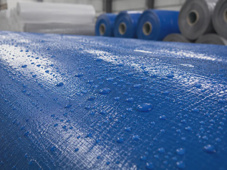 Water resistant laminated construction cover fabric for temporary site protection