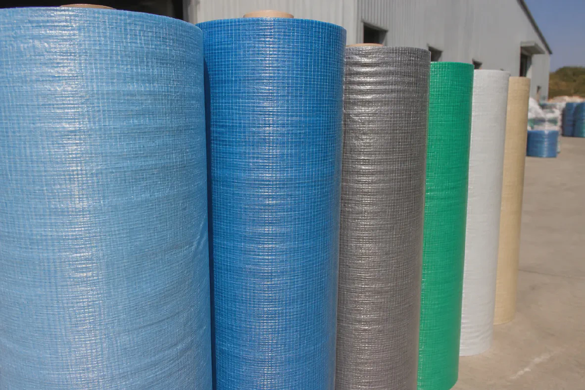 Laminated woven tarpaulin rolls stored in sunlight