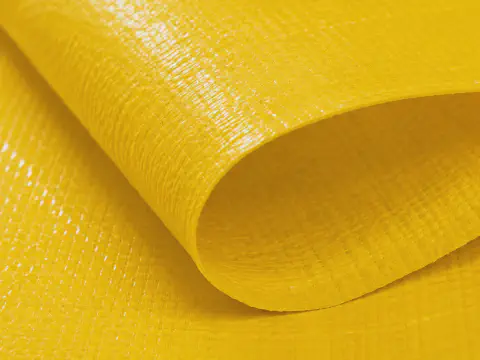 Yellow laminated PP woven fabric texture detail for construction cover rolls